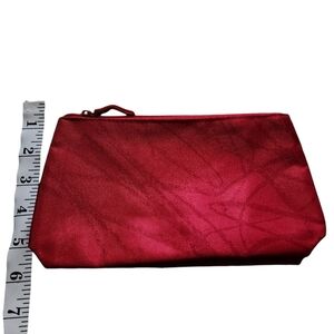 Red faux suede makeup mini bag by clinique